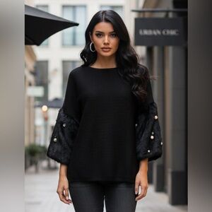 Elegant Black Sweater with Faux Fur Sleeves